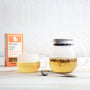 Kinto One Touch Tea Pot and Kinto Glass Tea Cup with Chamomile Flowers tea in