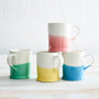 4 fenella mugs in pink, blue, yellow, and green