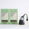 black floating tea strainer and two packs of loose peppermint tea