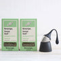 black floating tea strainer and two packs of loose peppermint tea